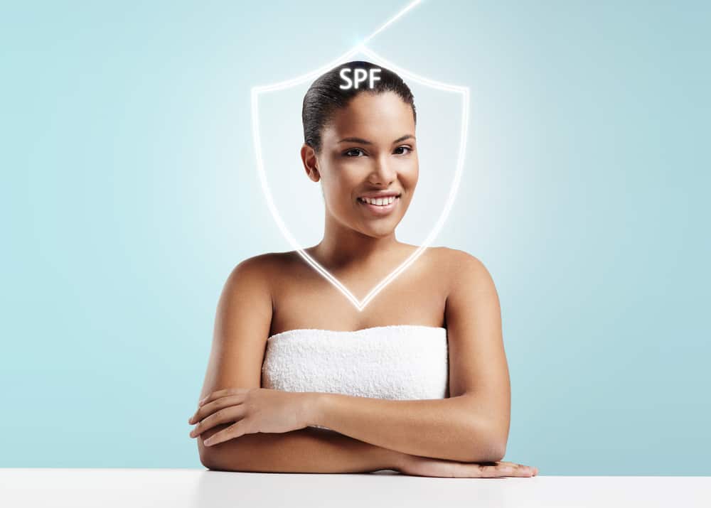 woman protected from the sun into the spf shield