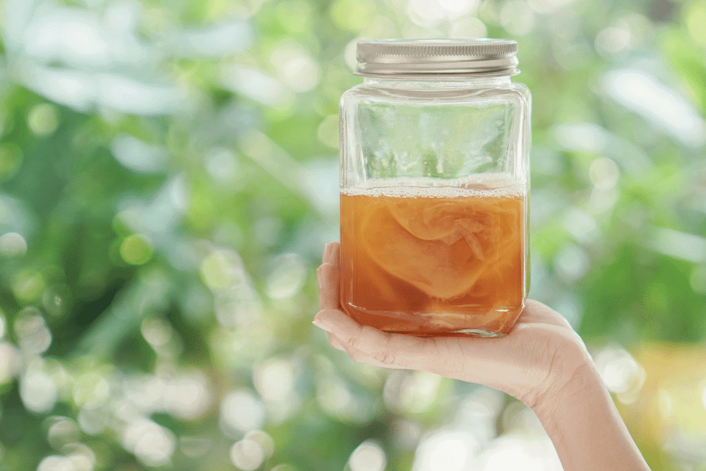 hand holding a Probiotic Tea